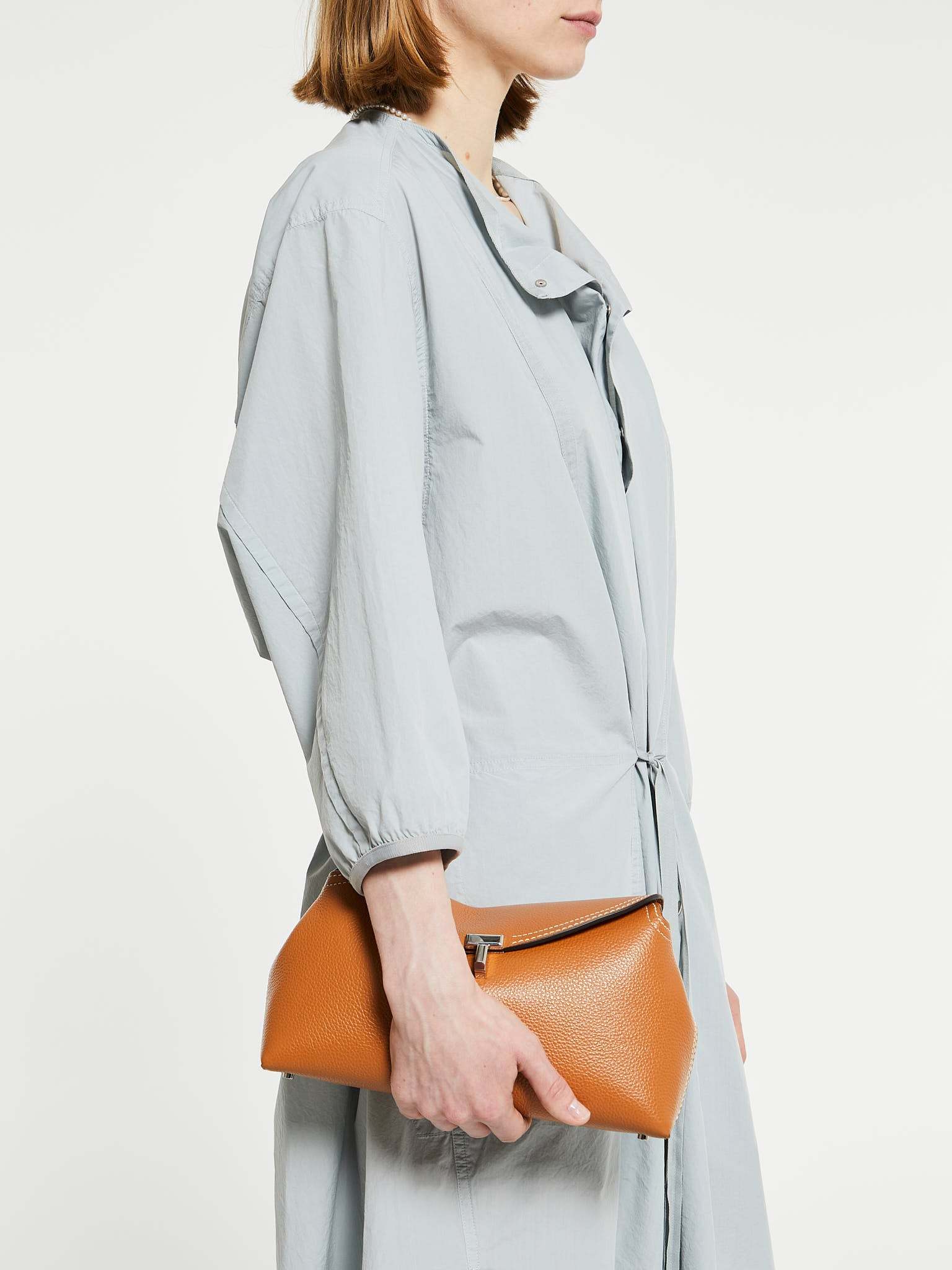 Totême T-lock Top Handle Bag In Pebble Grain Leather In Orange