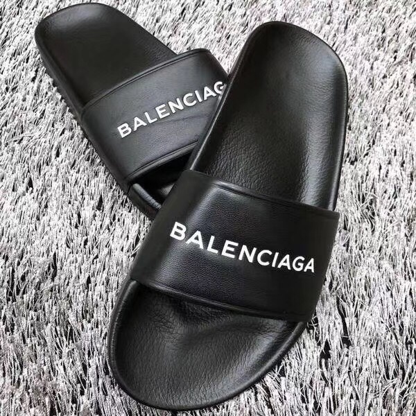 Balenciaga Logo-embossed Rubber Slides In Black