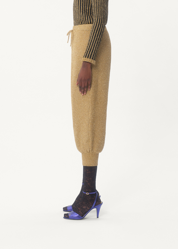 Shop Valentino Lurex Knit Trousers In Golden