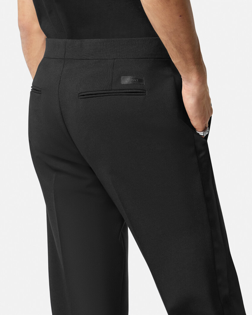 VERSACE VERSACE LOGO-APPLIQUÉ TAPERED-LEG CHINO TROUSERS