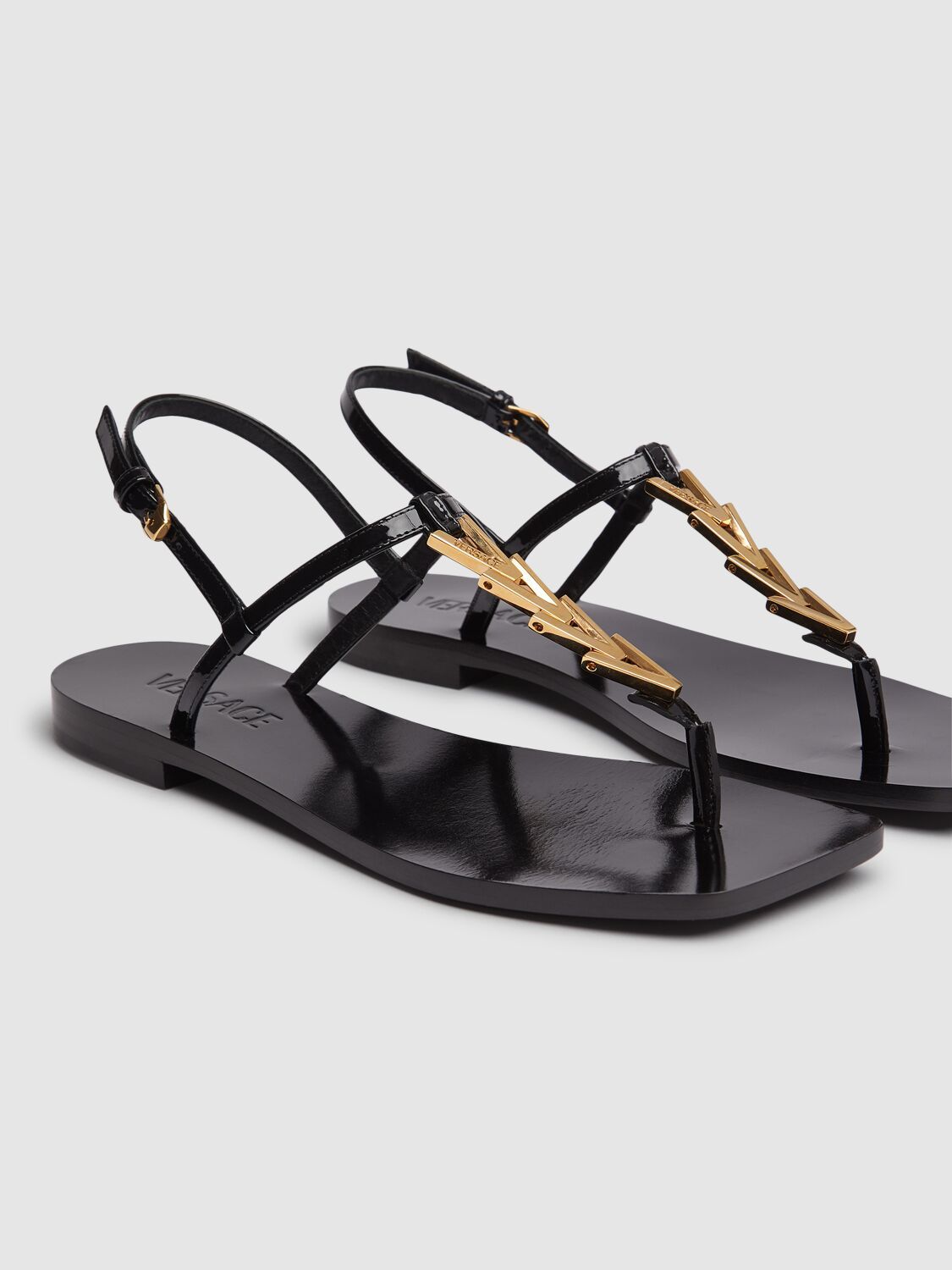 Shop Versace V-chain Leather Flip-flops Sandals