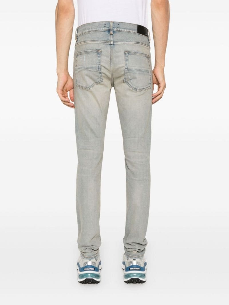 Amiri Mx1 Skinny-fit Panelled Distressed Jeans In Gray