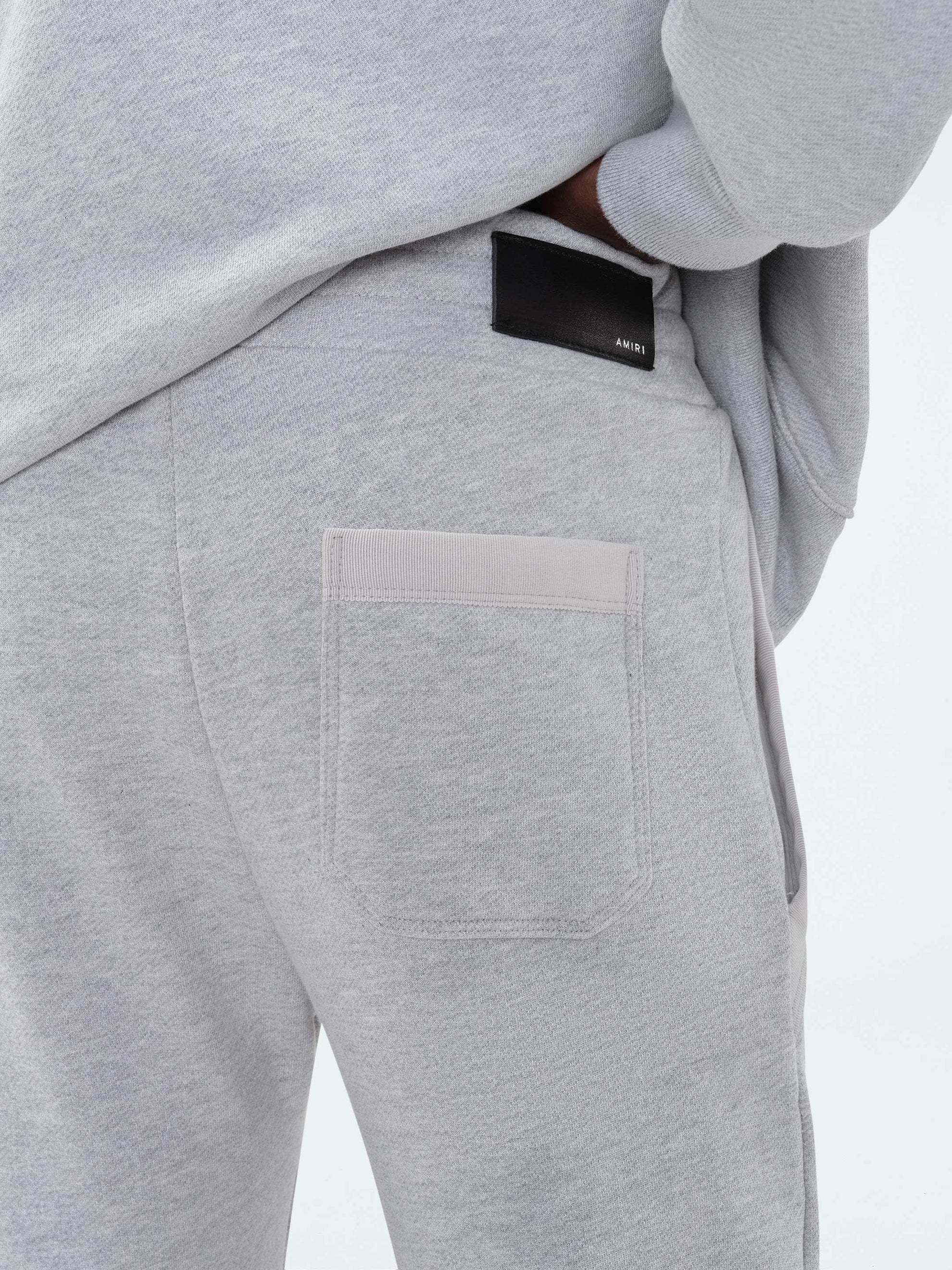 Amiri Logo Embroidered Sweatpants In Gray