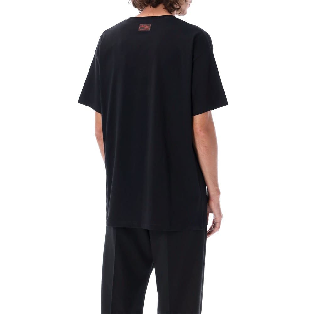 Raf Simons Slogan-print Short-sleeved T-shirt In Black