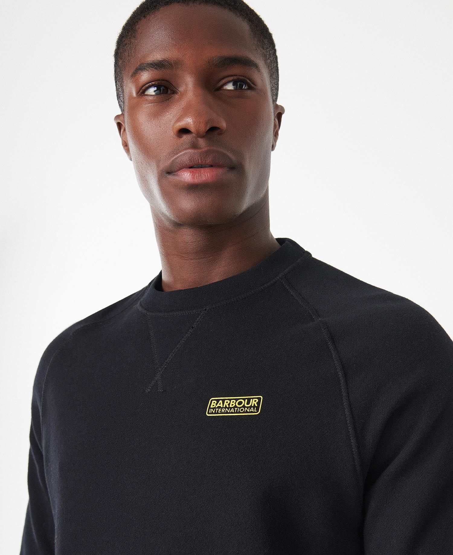 Shop Barbour Logo Detailed Long Sleeved Crewneck Sweatshirt In Black