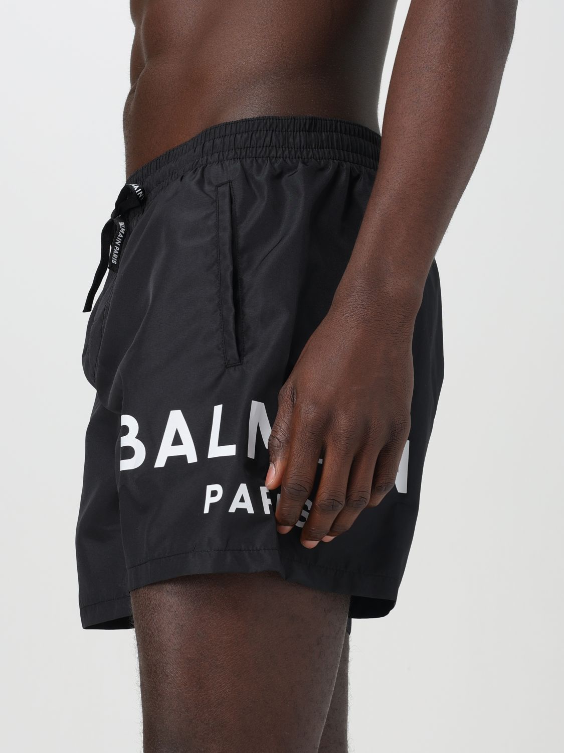 BALMAIN LOGO-PRINT SWIM SHORTS