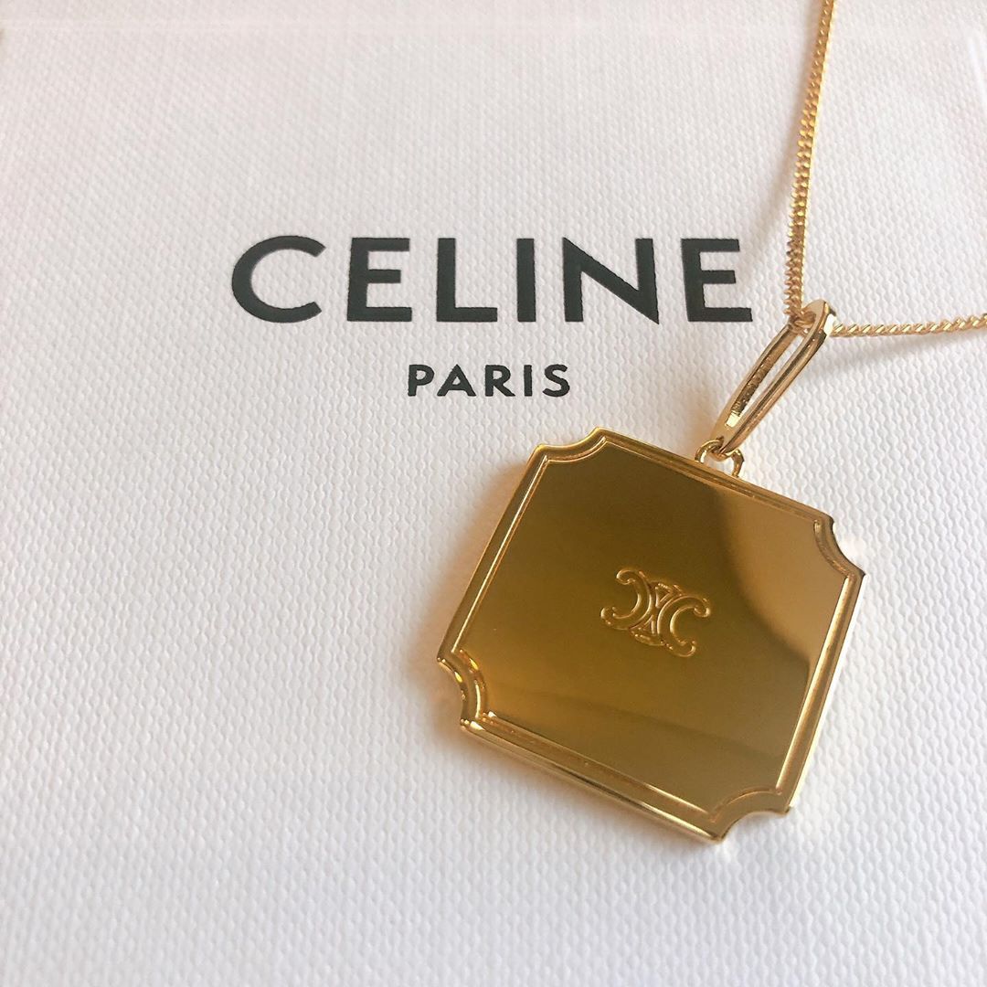 Celine Double C Carved Pendant In Yellow