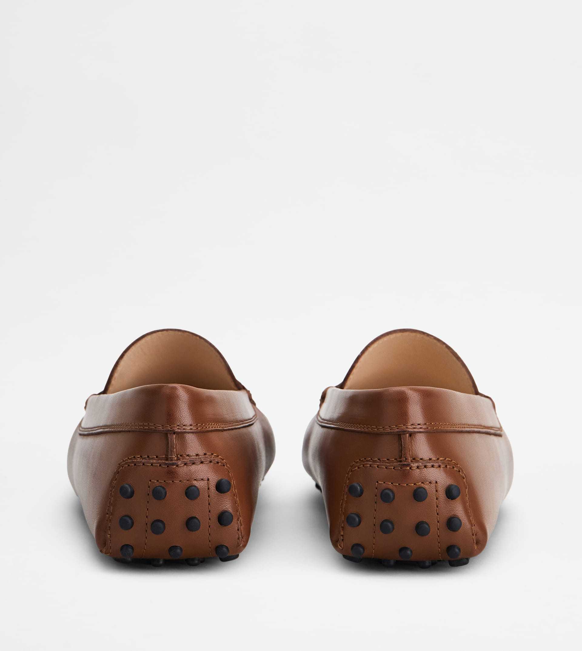 Tod's Penny Strap Loafers Stitch Detailing Rubber Sole In Brown