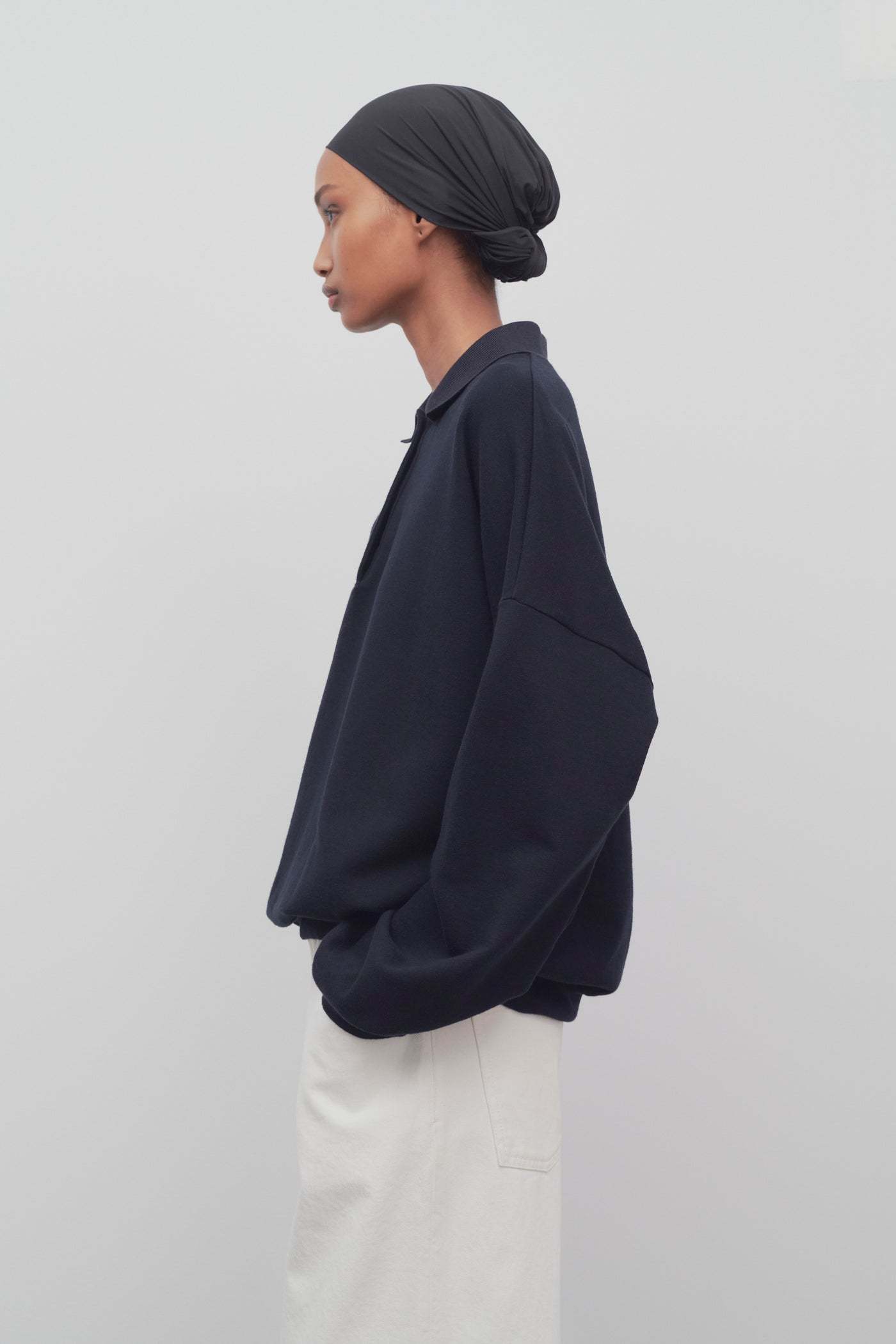 The Row Long-sleeved Polo Jumper In Black