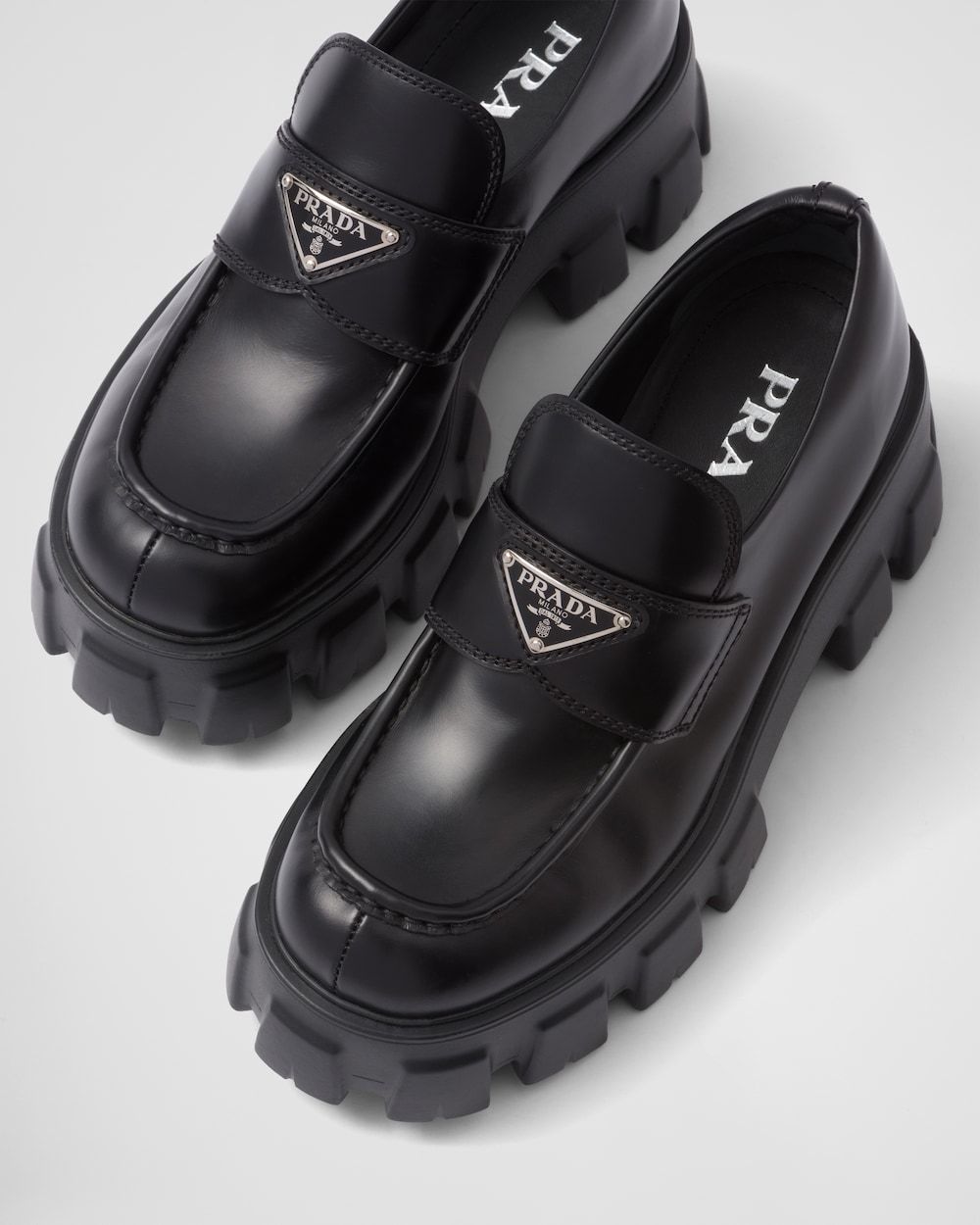 Shop Prada Brushed Leather Monolith Loafers In Black