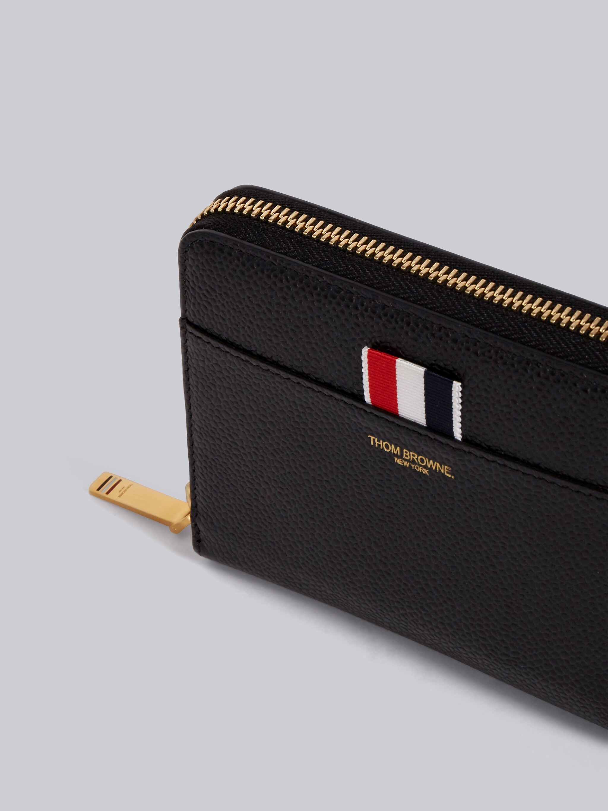 Thom Browne Logo Embossed Zipped Wallet In Black