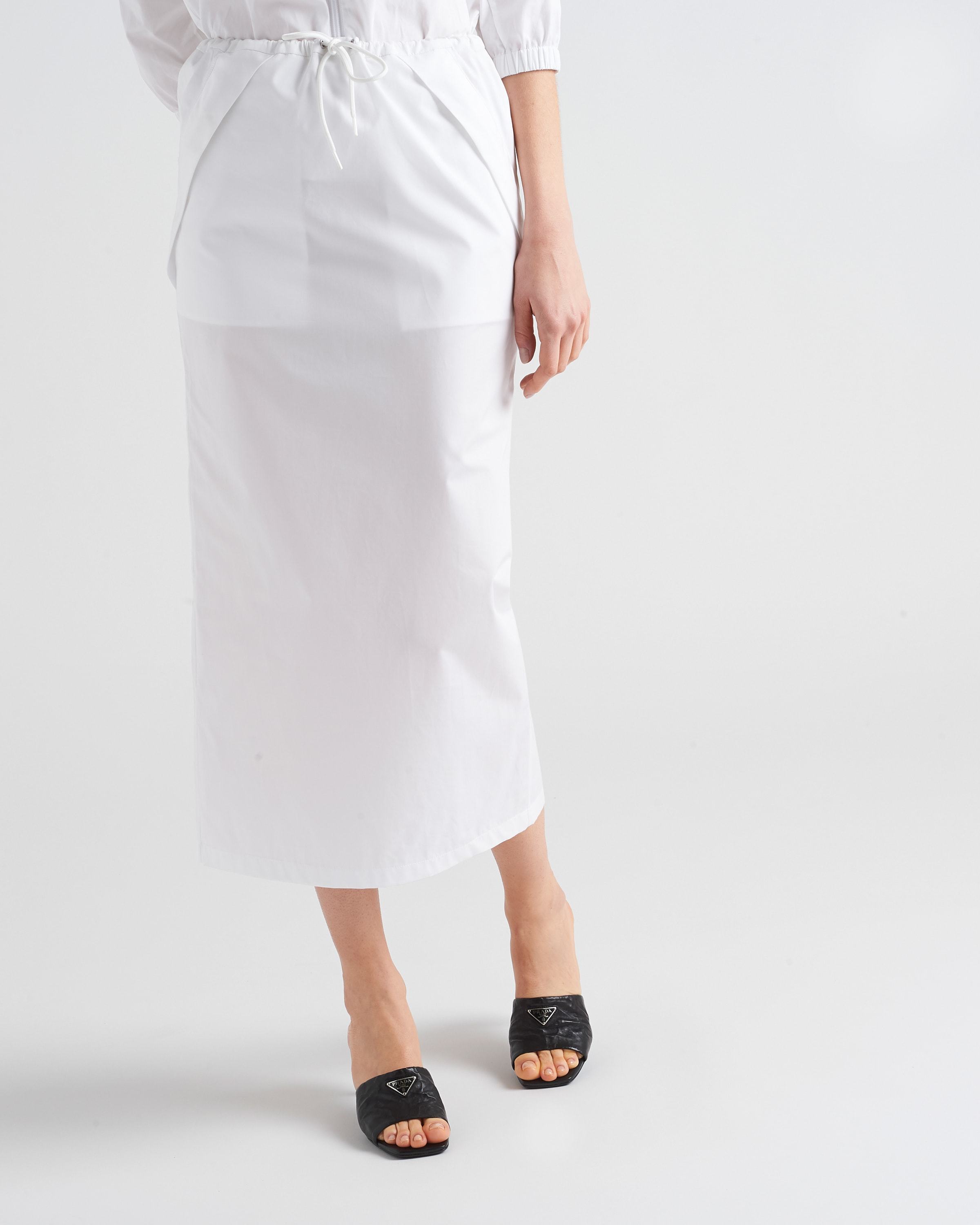 Prada Triangle Logo Quilted Mules In Black