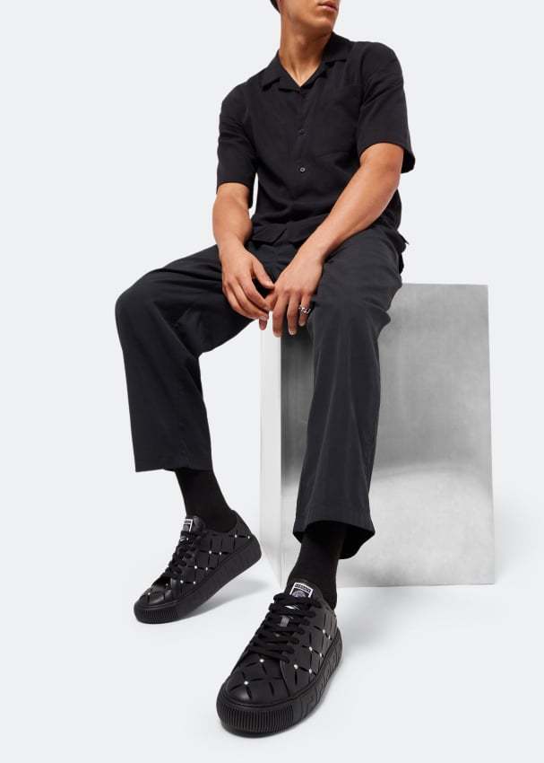 Versace Perforated Studded Sneakers In Black