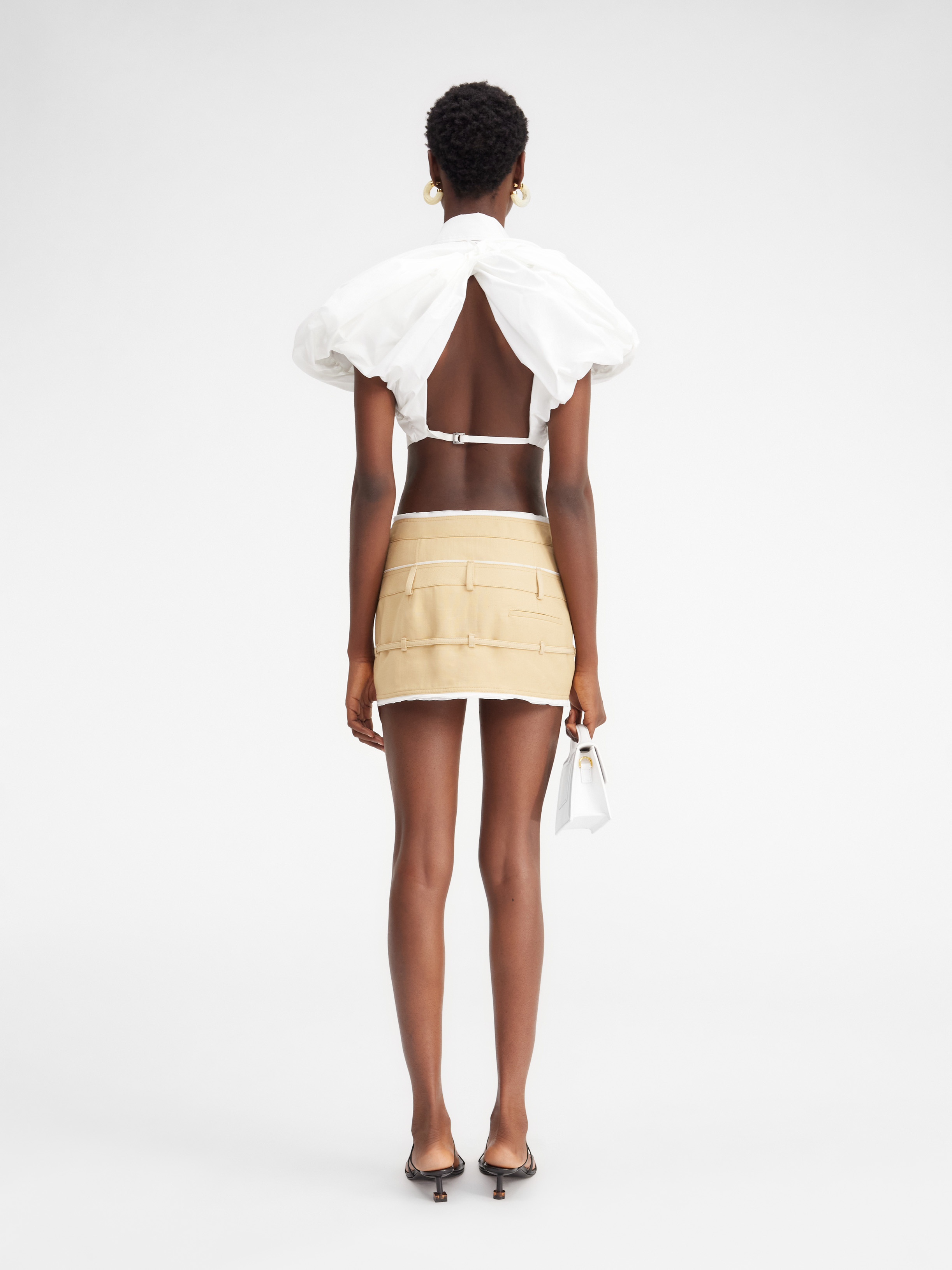 Jacquemus Caraco Buckled Layered Woven Mini Skirt In Nude