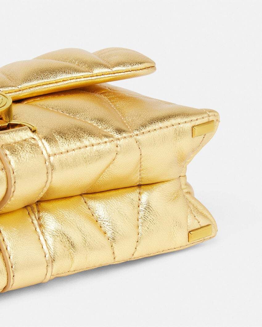 Versace Quilted Metallic Clutch Bag In Nude