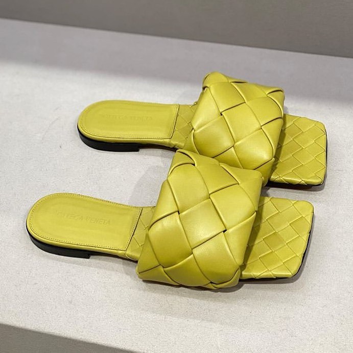 Bottega Veneta The Lido Flat Mules In Intrecciato Nappa Lambskin In Yellow