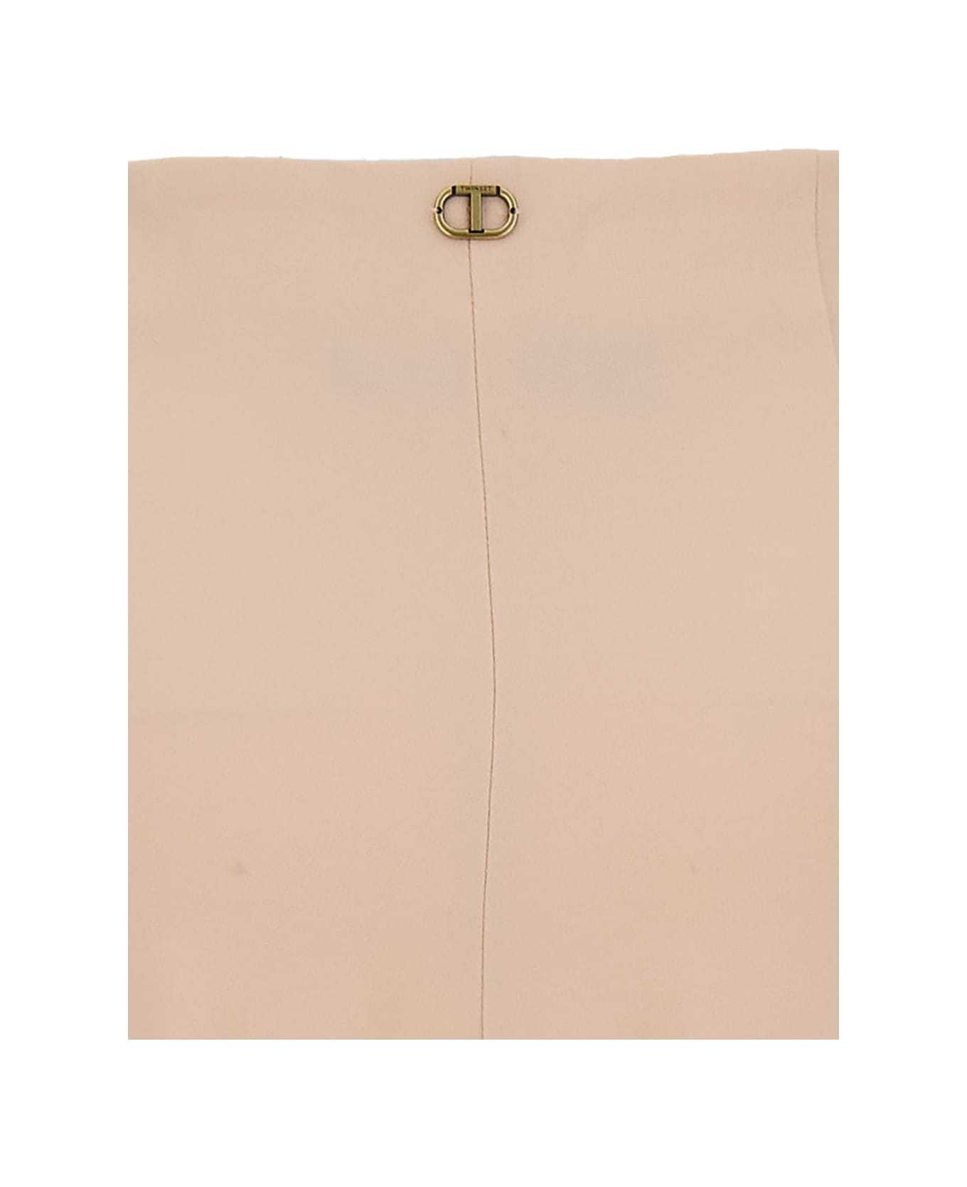 Twinset Pantaloni Svasati Con Placca Logo In Nude