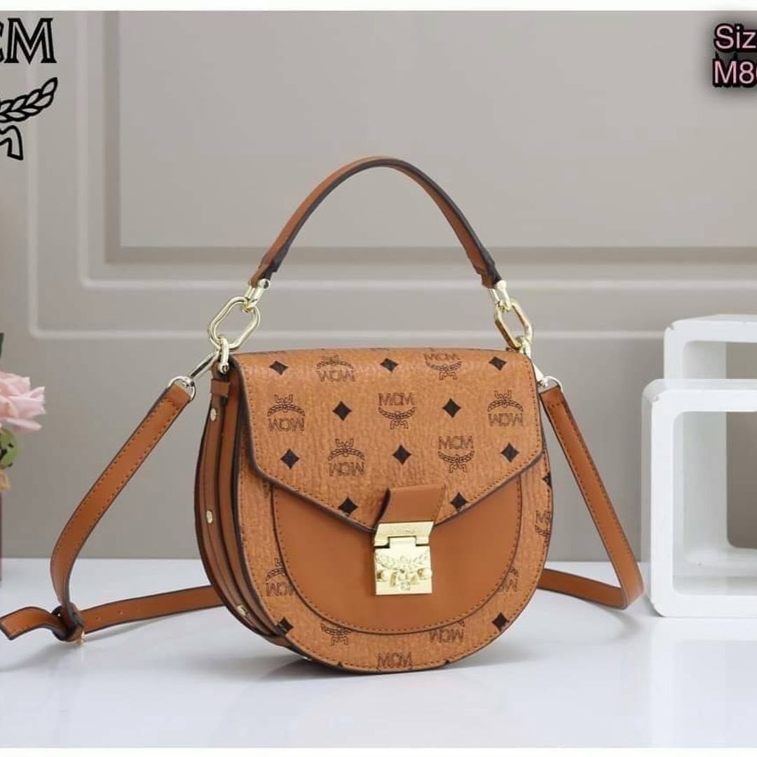 Mcm Printed Logo Handbag In Brown