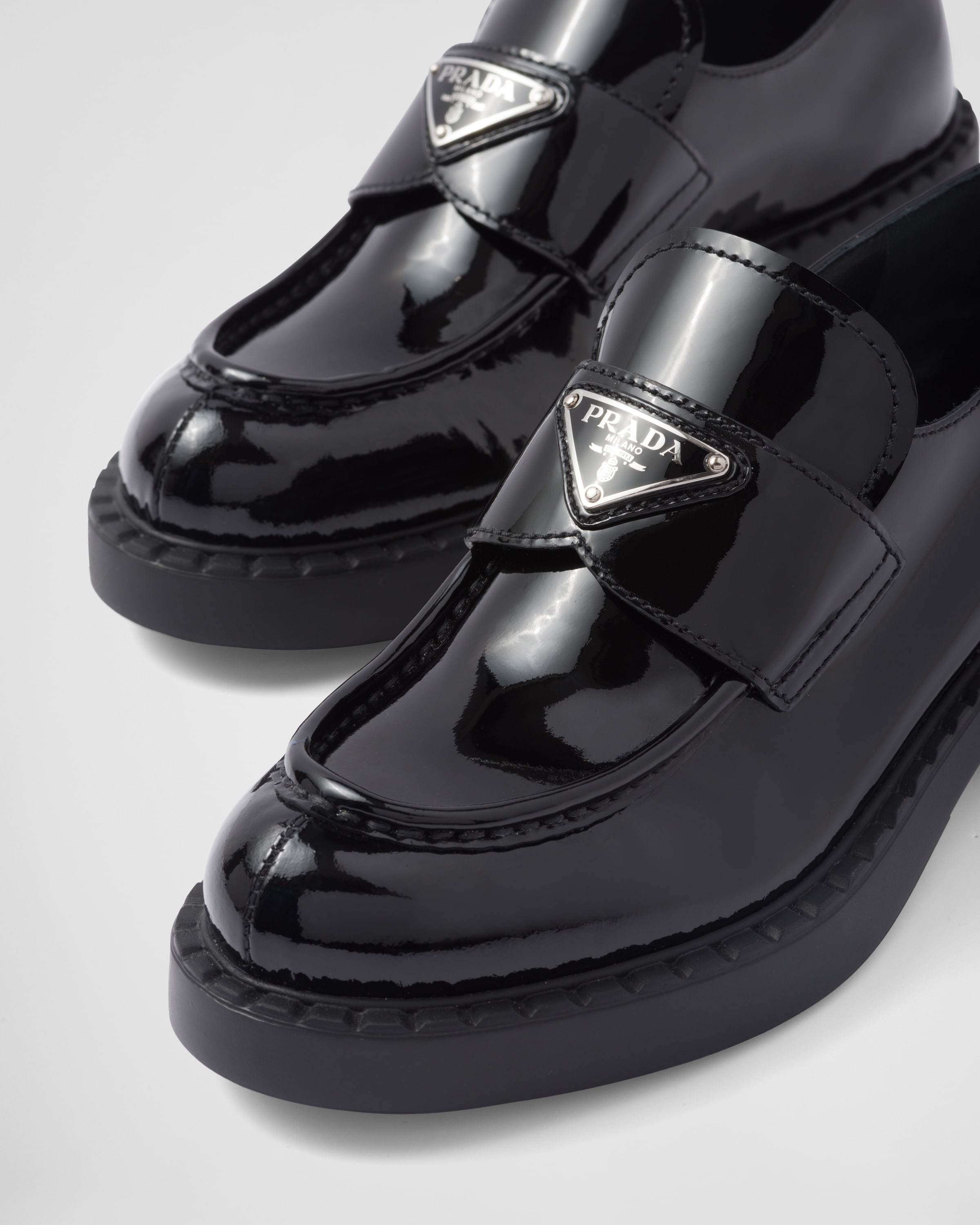 Prada Logo-plaque Leather Loafers In Black