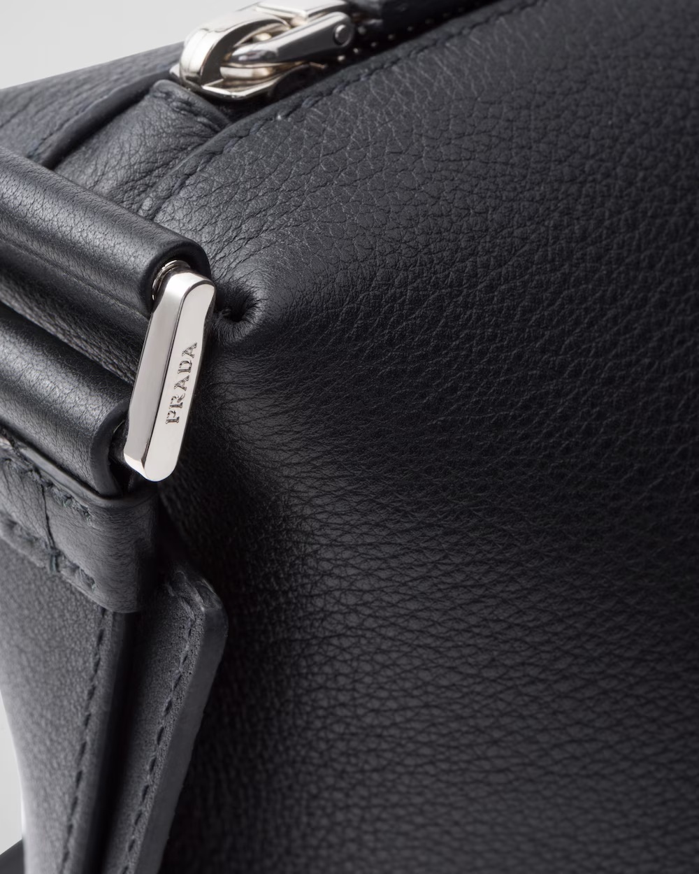 Prada Logo Print Leather Messenger Bag In Black