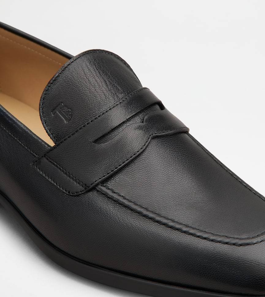 Tod's Logo-debossed Leather Penny Loafers In Black