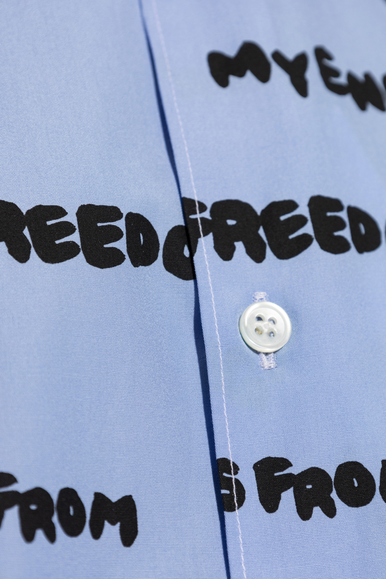 Comme Des Garçons Cotton Shirt With All Over Slogan Print In Blue