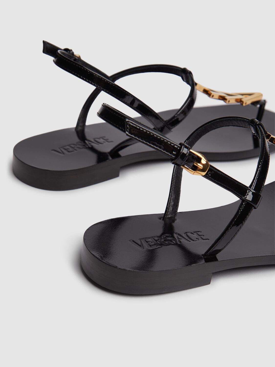 Shop Versace V-chain Leather Flip-flops Sandals