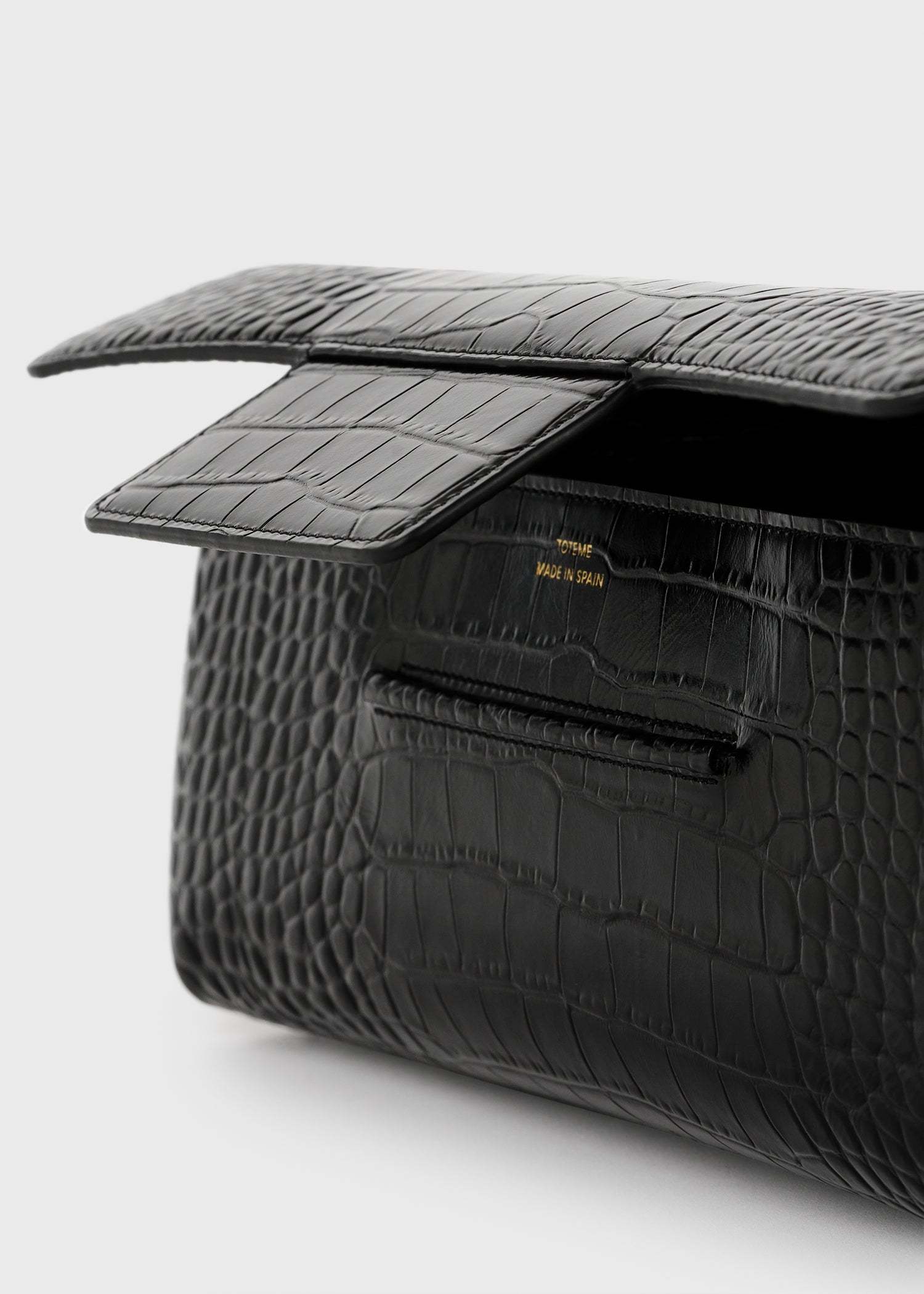 Totême Croc-embossed Flap Clutch Bag In Black