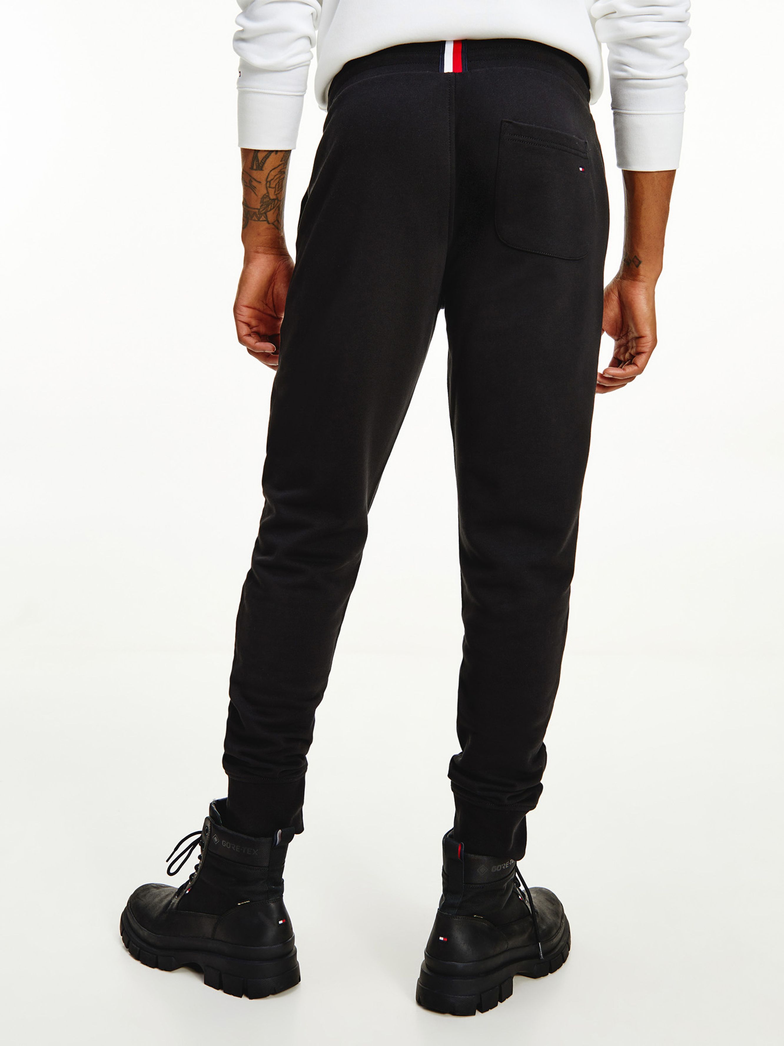 Shop Tommy Hilfiger Logo Print Joggers In Black