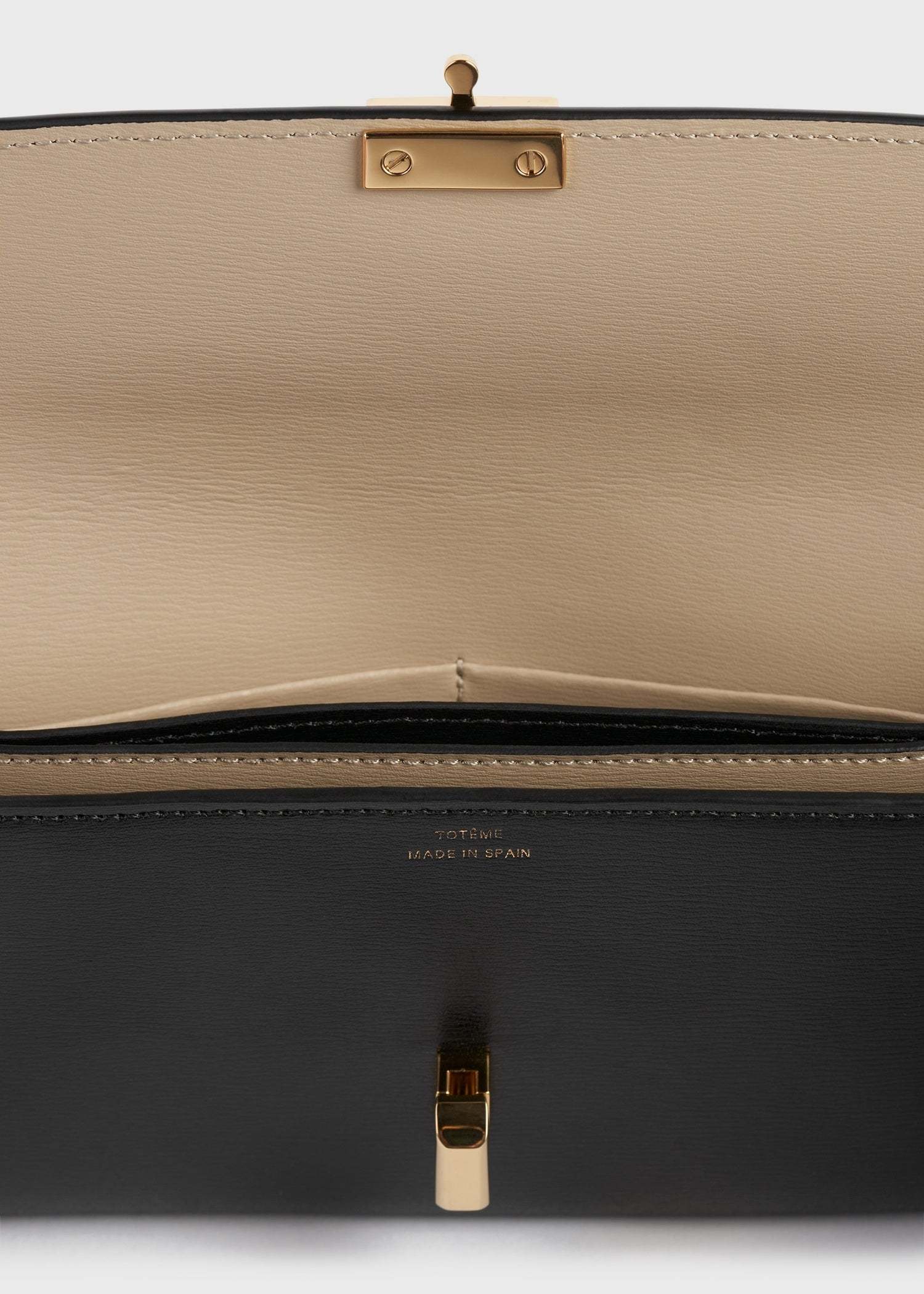 Totême Toteme T Lock Fold-over Leather Continental Wallet In Black