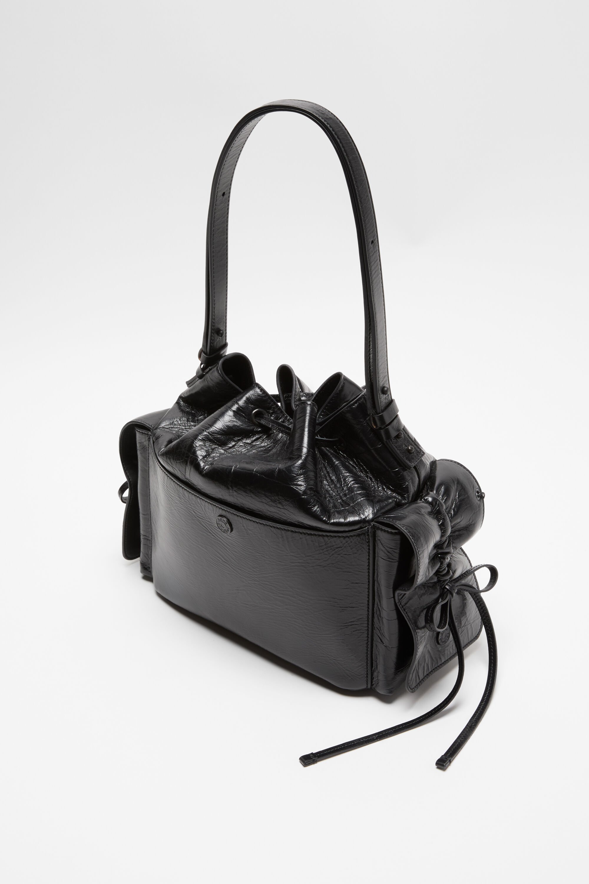 Acne Studios Drawstring Ruffled Leather Shoulder Bag In Black