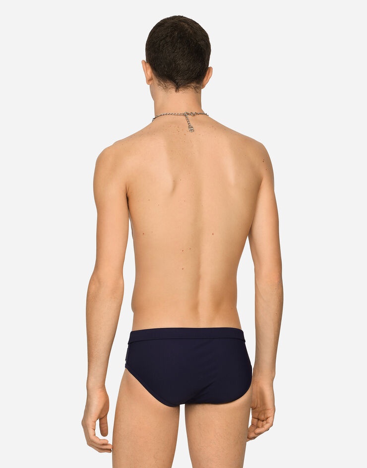 Dolce & Gabbana Swim Briefs With High-cut Leg And Branded Plate In Black
