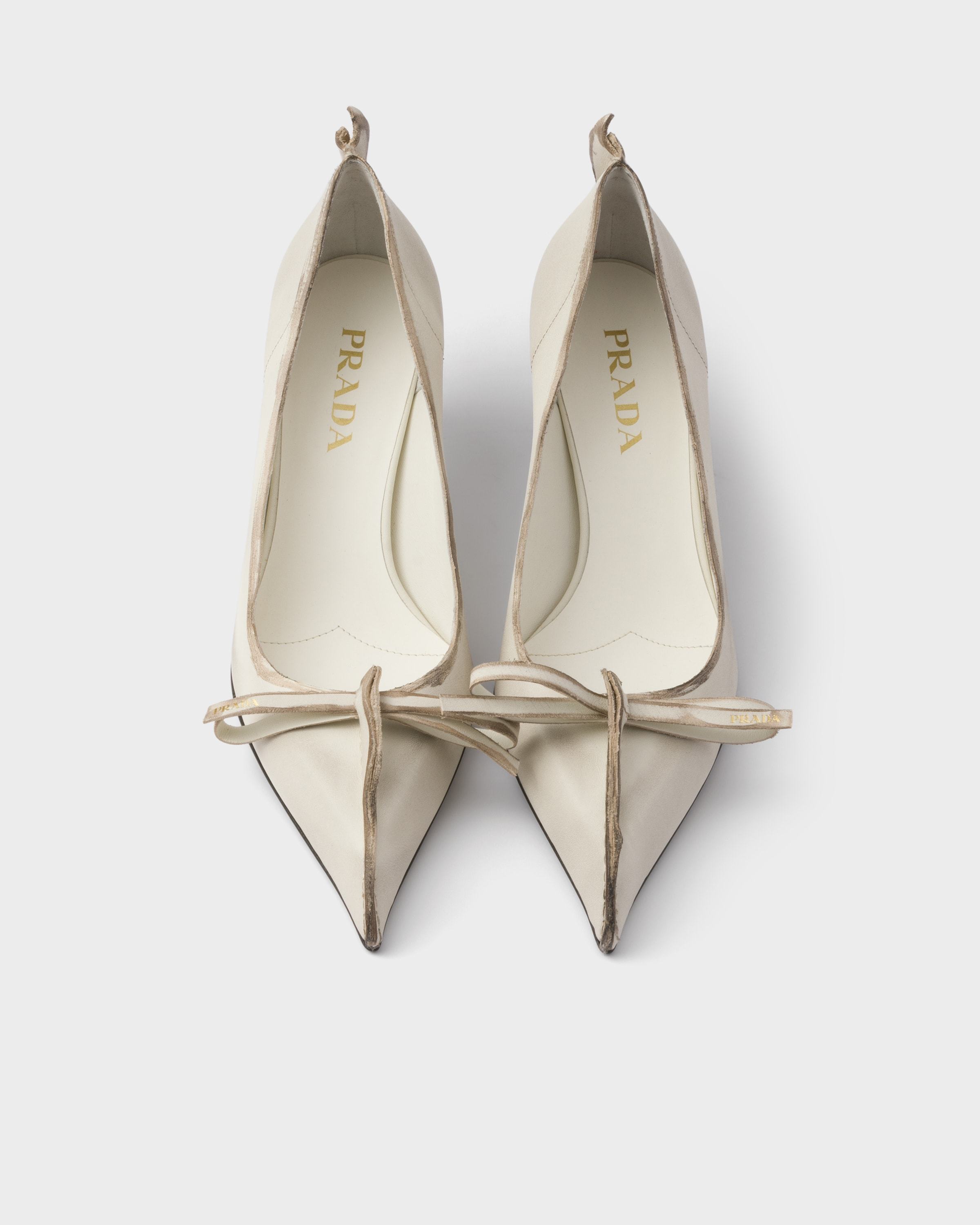 Prada Exposed Seam Kitten Heel Pump In Neutral