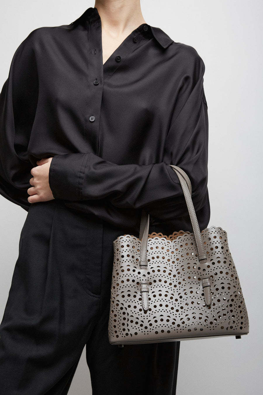 Alaïa Hollowed-out Design Shoulder Bag In Gray