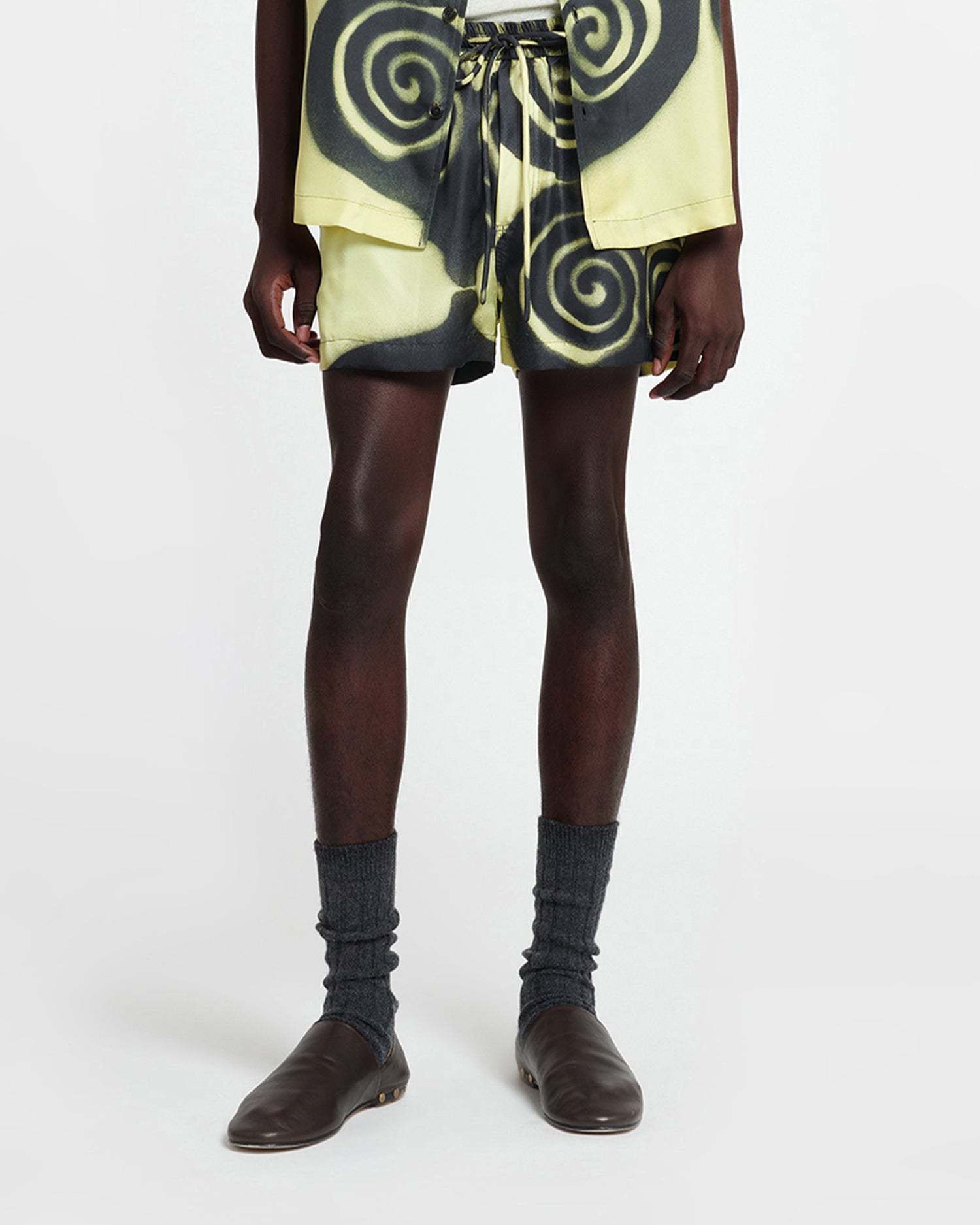 Nanushka Amil Spiral-print Silk Shorts In Black