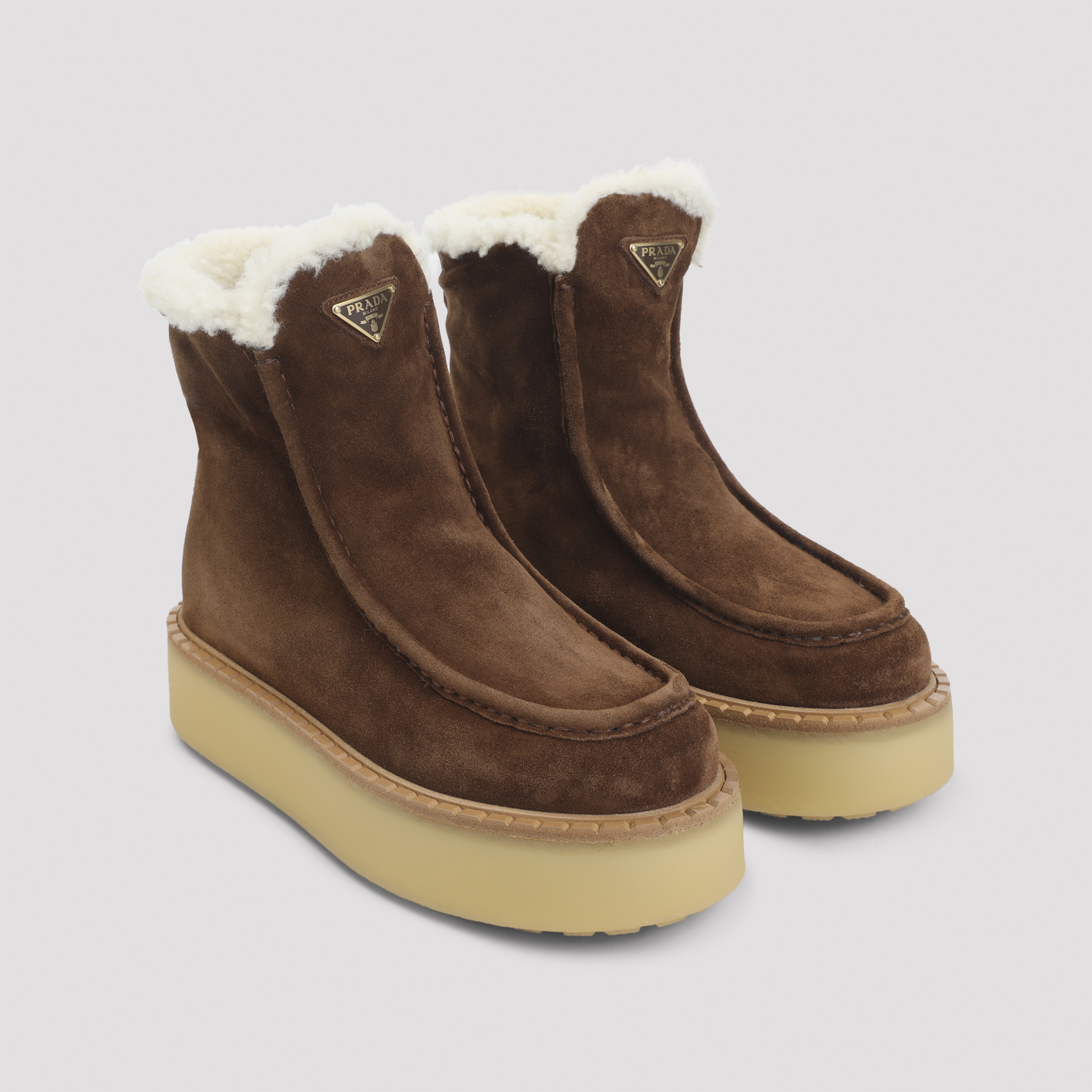 Prada Platform Booties Featuring Shearling Lining In Brown