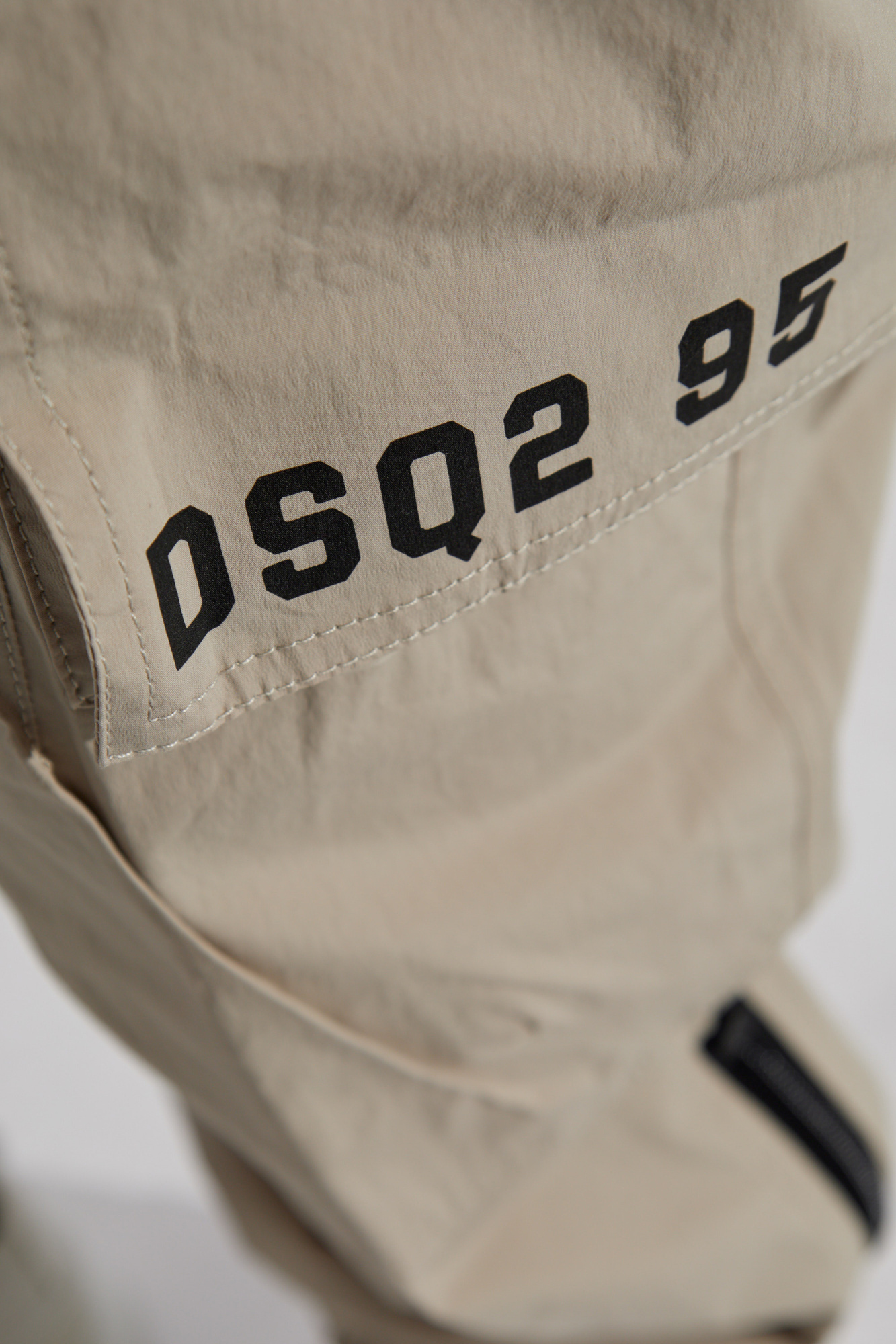 Dsquared2 Logo Printed Tapered Cargo Trousers In Nude