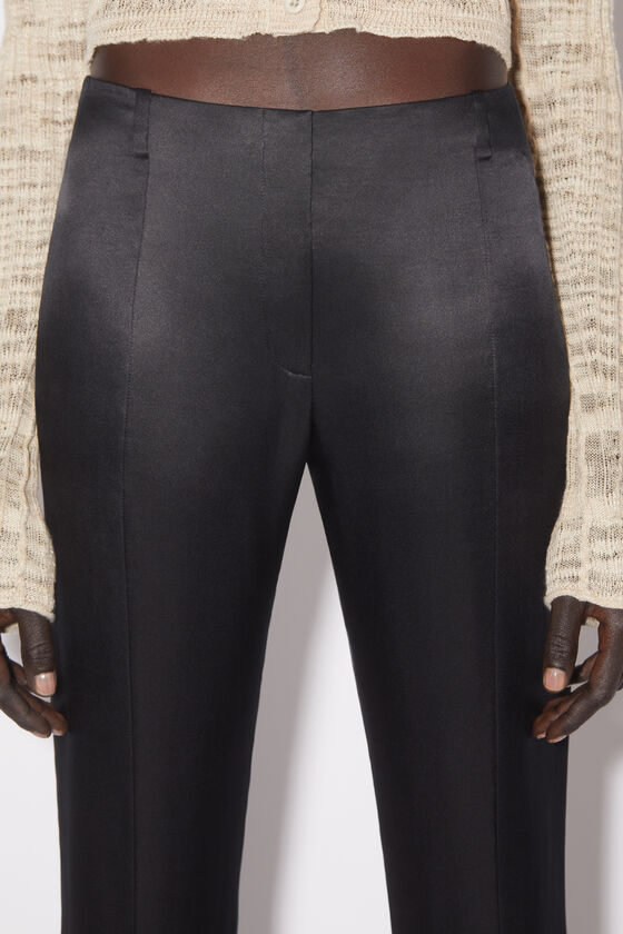 Acne Studios Low-rise Flared Trousers In Black