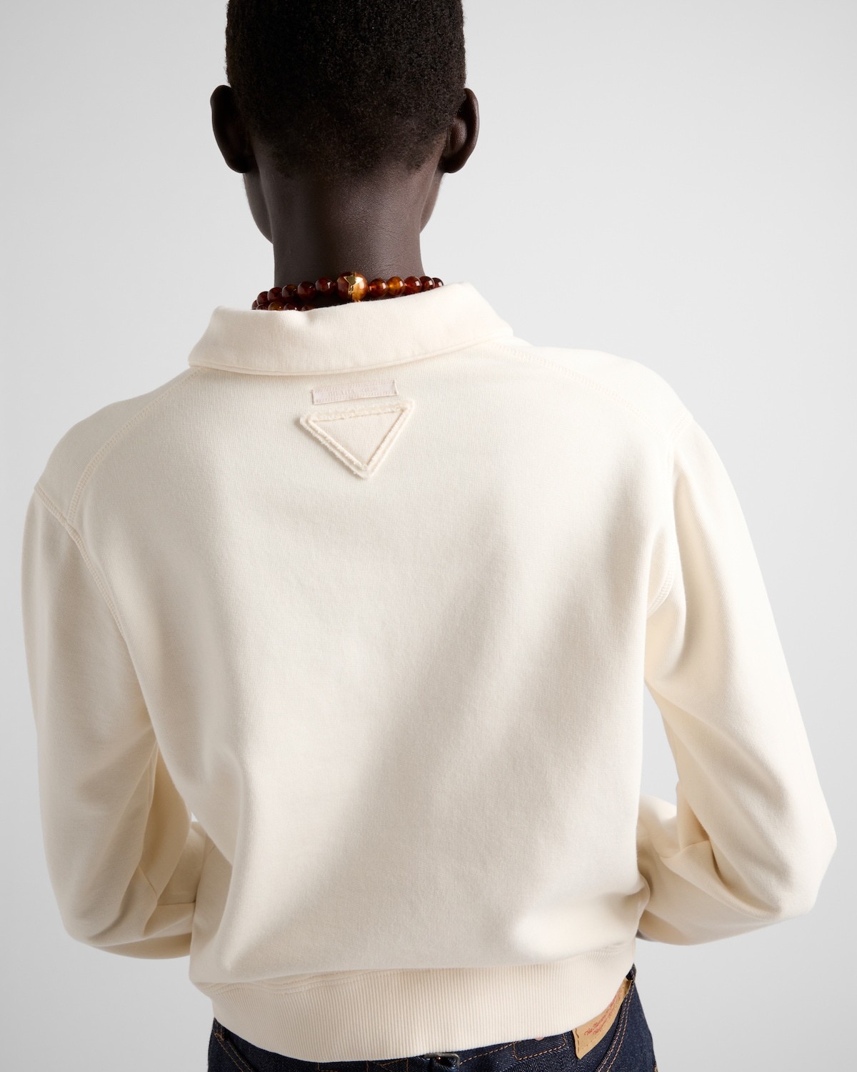 Prada Logo-embroidered Long-sleeved Polo Shirt In White