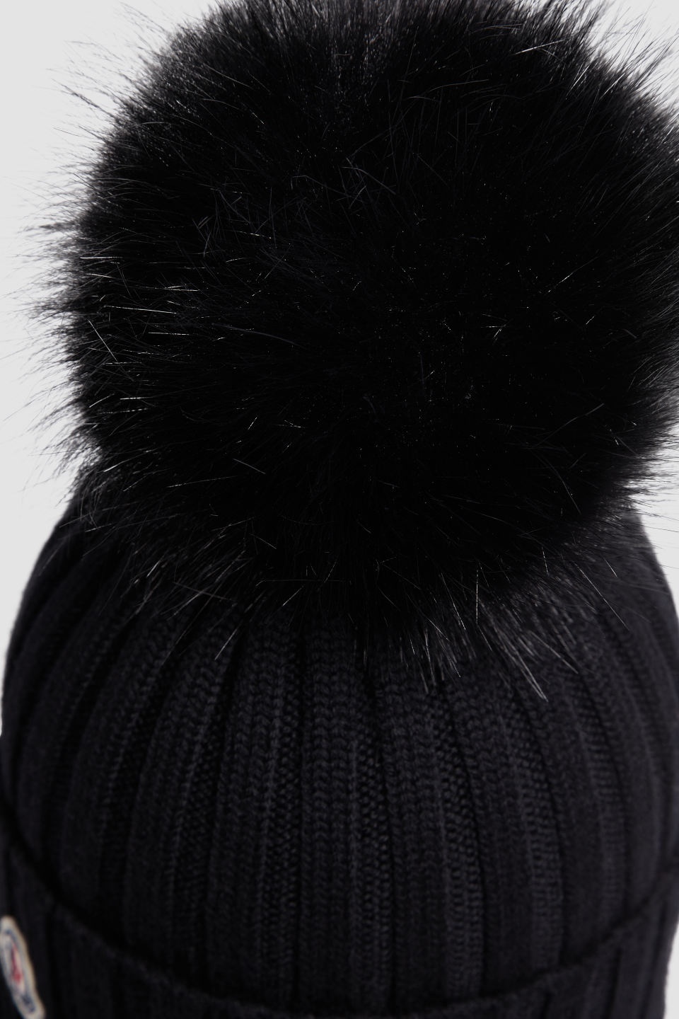 Moncler Ribbed Knit Wool Beanie With Faux Fur Pom-pom In Black