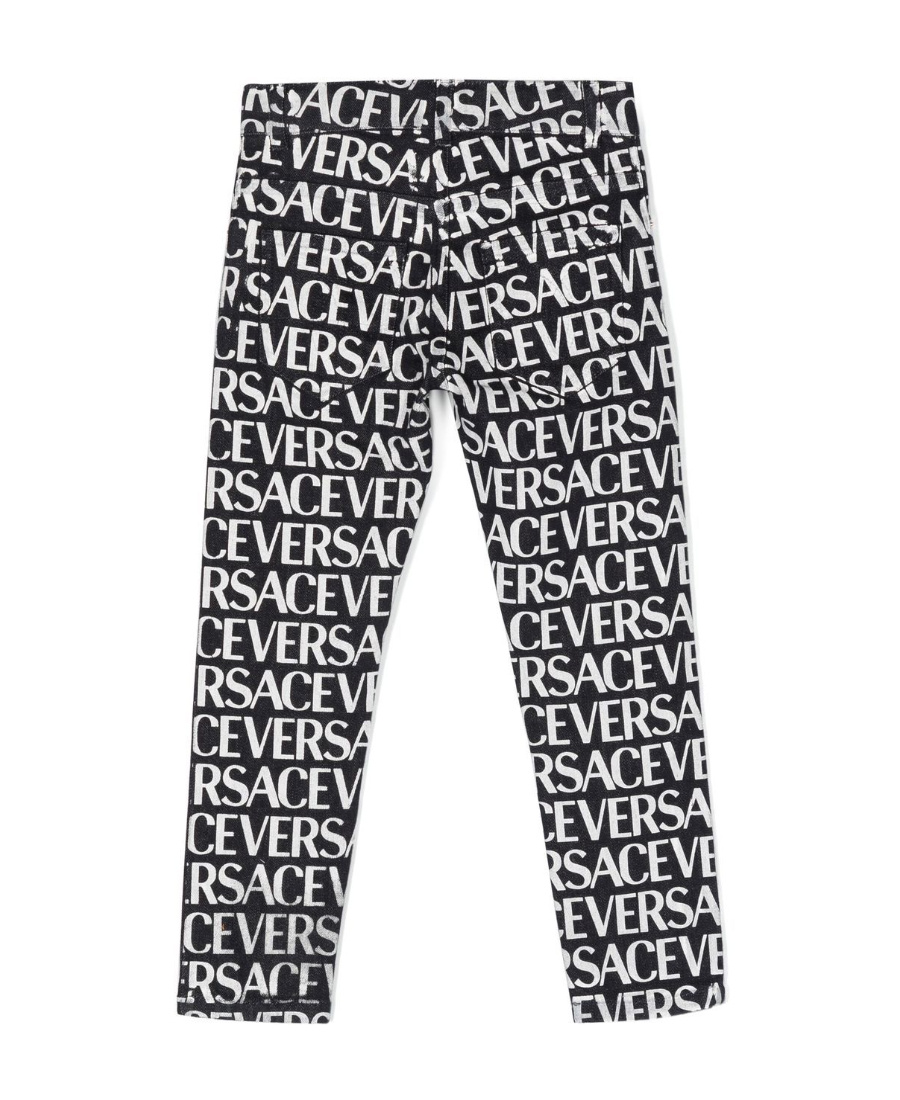 Versace Metallic Logo Print Jeans In Black