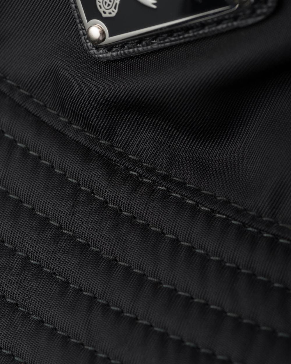Prada Logo Plaque Bucket Hat In Black