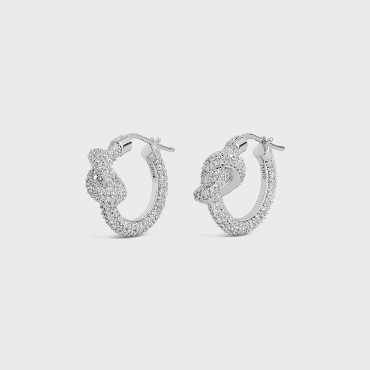 Celine Knot Sparkle Hoops In Strass And Brass With Rhodium Finish In Silver