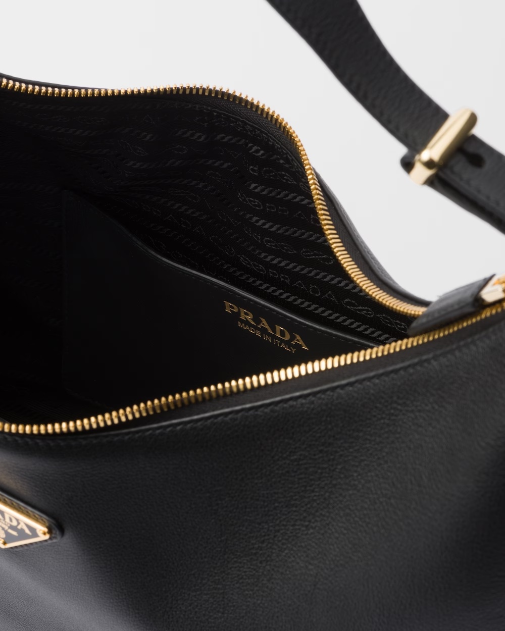 Prada Rounded Shoulder Bag With Gold-tone Hardware In Black