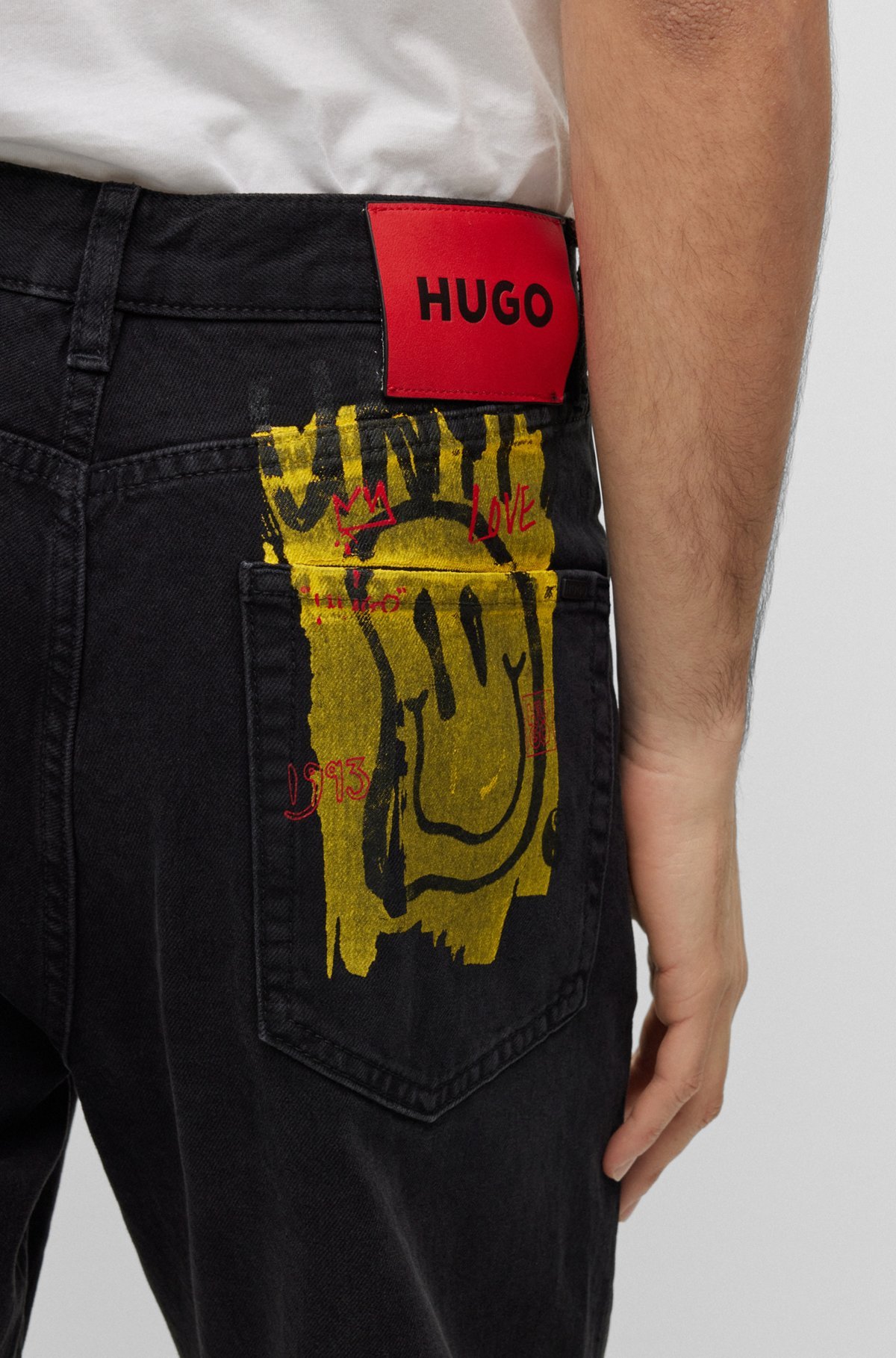 Hugo Boss Smiley-print Mid-rise Slim-fit Jeans In Black