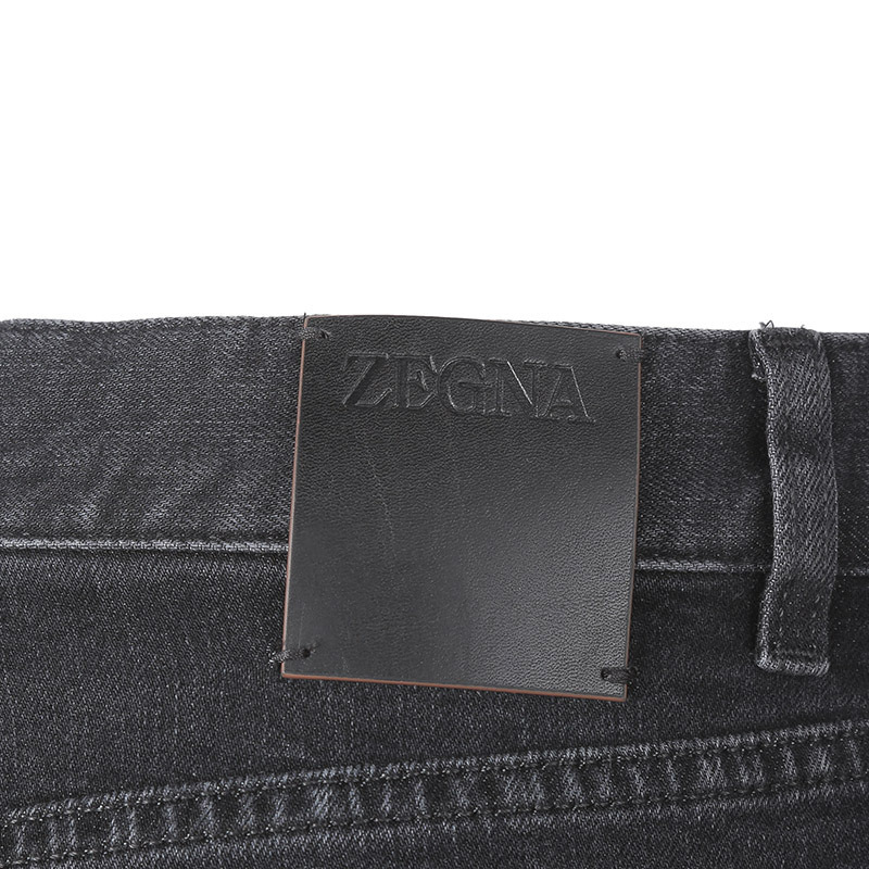 Shop Zegna Tapered Five-pocket Jeans In Black
