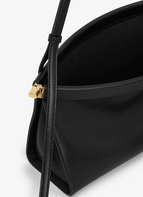 Shop Alaïa Small Le Click East West Shoulder Bag In Black