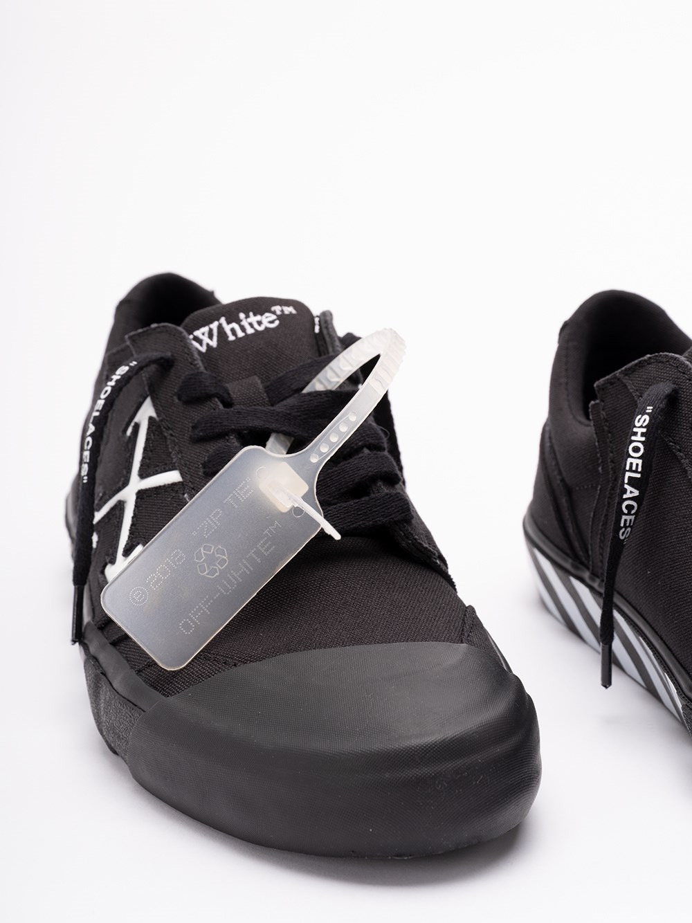 Off-white Low-top Canvas Sneakers Featuring Contrast Stripe In Black