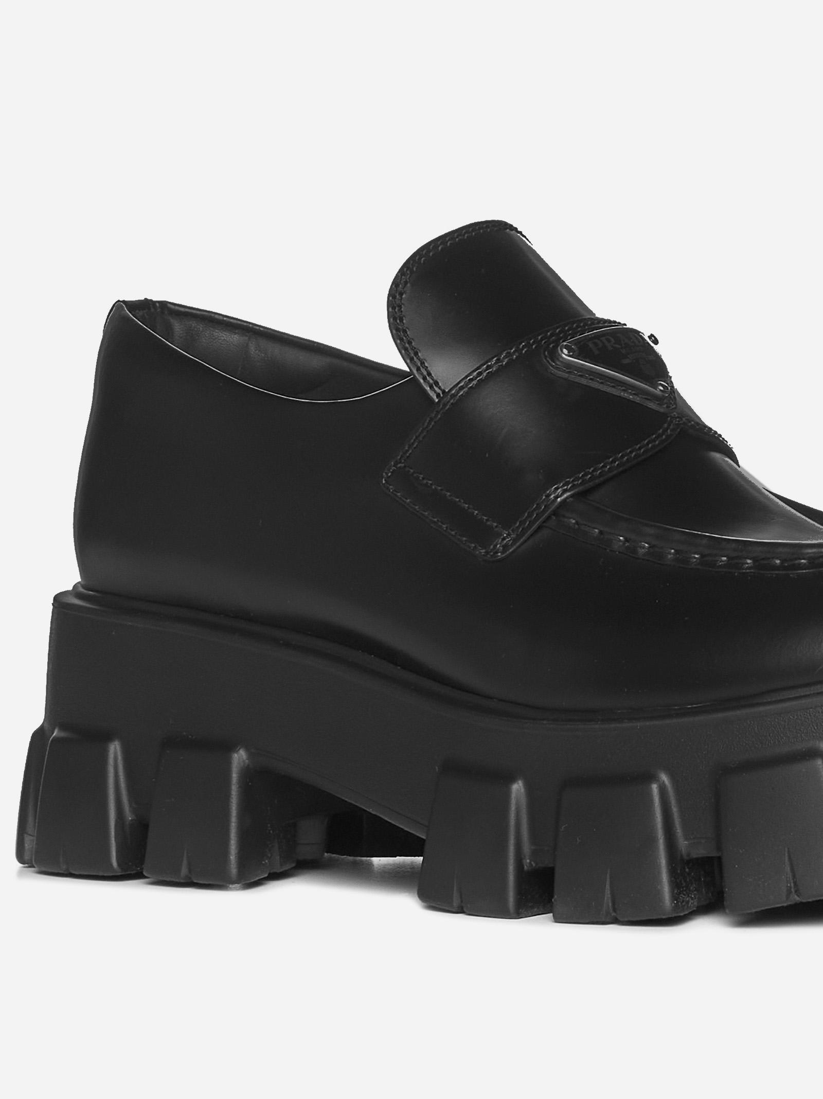 Shop Prada Brushed Leather Monolith Loafers In Black