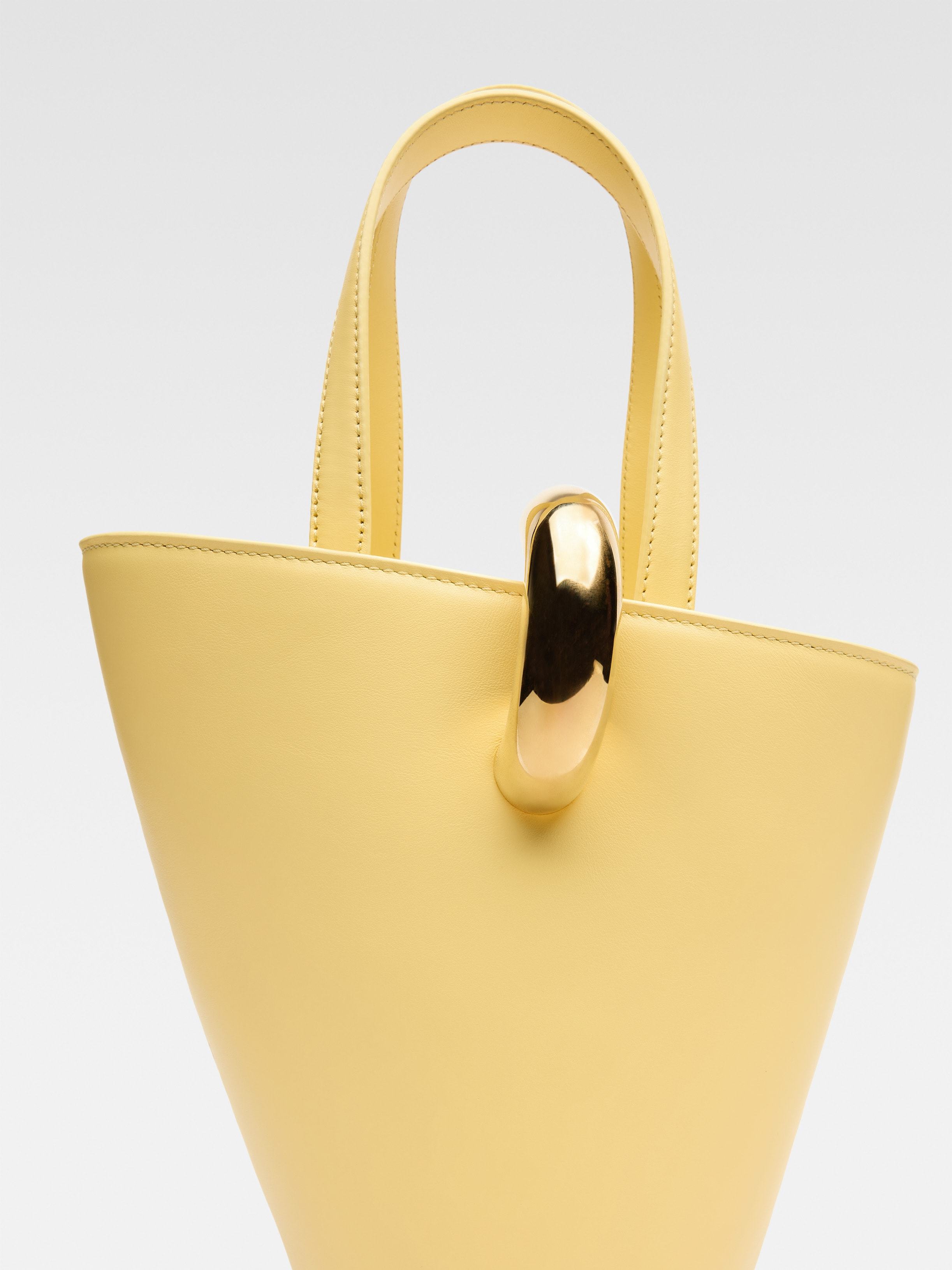 Jacquemus Le Petit Bambola Leather Bucket Bag In Light Yellow 210
